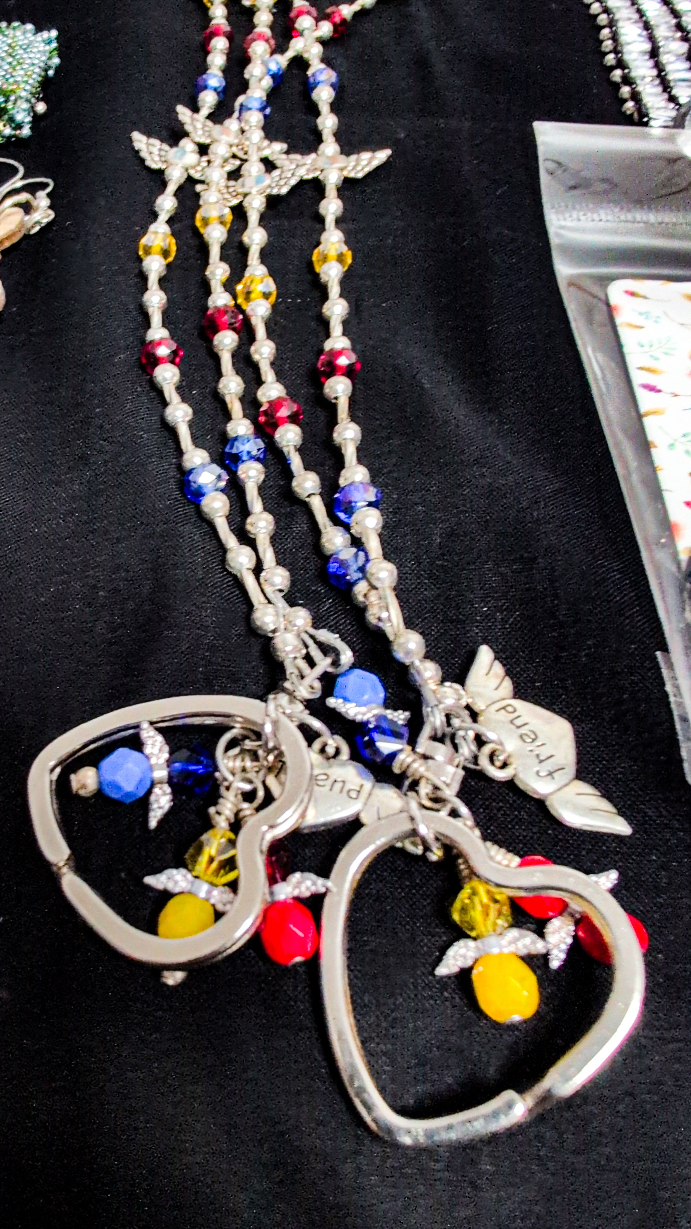 Beaded lanyard Blue,red, yellow with charms
